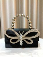 Sacs de soirée de luxe en forme de papillon, avec nœud en strass, pochette de mariage pour mariée, chaîne de perles, doublure en polyester, style tendance