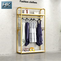 Étagère de présentation de vêtements minimaliste sur mesure, en métal, de haute qualité, durable, pour boutique de vêtements pour femmes, magasin, centre commercial