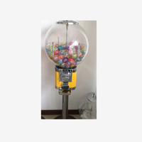 Distributeur automatique de boules rebondissantes de bonbons à pièces de nouvelle conception avec support
