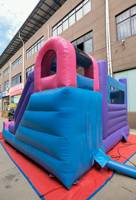 Château gonflable commercial extérieur sur le thème des bonbons rose avec toboggan gonflable pour location de fête pour enfants