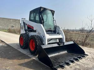 Chargeuse compacte sur pneus S160, roues blanches et rouges, machine de construction d'occasion - Product Image 3