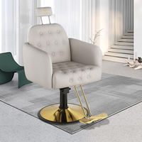 Vente en gros, fauteuil de barbier noir en cuir cabossé avec appui-tête et dossier en métal avec piètement rond doré