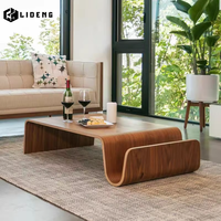 Table basse moderne extensible en bois massif avec design incurvé pour salon