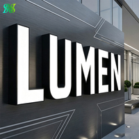 Lettres lumineuses noires et blanches pour façade de bâtiment d'entreprise et signalétique de réception