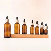 Flacon compte-gouttes en verre brun de 5 ml, 10 ml, 15 ml, 20 ml, 30 ml, 50 ml, 100 ml, flacon d'huile essentielle ambrée avec bouchon compte-gouttes doré