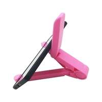 Support portable multifonctionnel simple et créatif, pliable, design paresseux pour téléphone portable et tablette de bureau, fabriqué en plastique durable