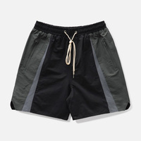 Logo personnalisé Vêtements de sport Panneau Design Short coupe-vent en nylon avec poches à taille élastique de 5 pouces pour hommes