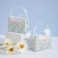 Boîte de bonbons de mariage de style ins personnalisé forme de sac à main imprimé de fleurs emballage en papier écologique avec poignée vente en gros