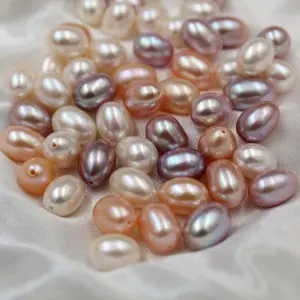 Medio perforado real forma de la gota de perlas de agua dulce de alta calidad impecable forma de arroz natural perla suelta
