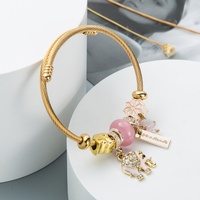 Bracelet en alliage doré incrusté de diamants, style bohème rétro ethnique européen et américain, avec éléphant, papillon et pierres précieuses
