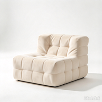 Fauteuil moderne en tissu capitonné avec design modulaire rembourré en peluche pour salon de luxe et coin détente à domicile