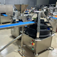Machine automatique de façonnage et de division de boules de pâte à pain, à pizza, et de pâte à brioches, pour des formes coniques et rondes