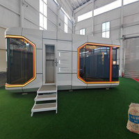 Maison de navire préfabriqué Paquet plat Maisons de capsule mobiles Maison prête à l'emploi Maison Structure en acier Famille d'accueil Capsule spatiale détachable