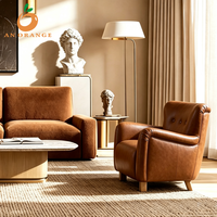 Fauteuil rembourré tendance pour salon, chaise à ailes évasées, coussin en cuir moelleux, pieds en chêne, mobilier pour hôtel et villa