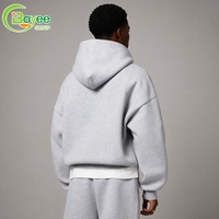 Ensemble de survêtement décontracté pour homme, style streetwear, comprenant un sweat à capuche court coupe ample gris chiné et un pantalon de survêtement large assorti, marque privée