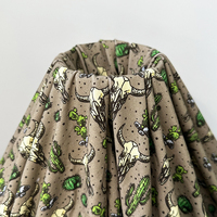 Tissu extensible en fibre de bambou de quantité minimale de commande basse personnalisé OEM Motif de créateur de crâne de taureau de cactus de conception occidentale pour barboteuse pour bébé.