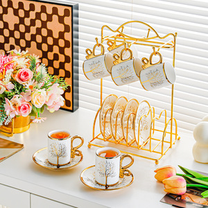 Ensemble élégant de tasse à café et soucoupe en céramique avec motif d'arbre doré pour le thé de l'après-midi - Product Image 1