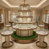 Vitrine de présentation de lunettes de luxe en or champagne, niche murale rétroéclairée, îlot tour rond, mobilier pour magasin de lunettes et boutique d'optique