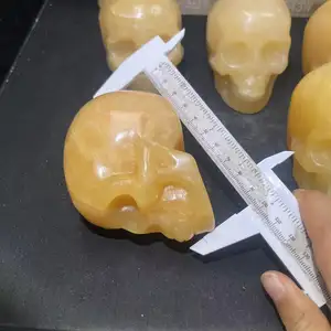 Wholesale High Quality Hand Carved Natural Crystal Orange Calcite Skulls For Decoration