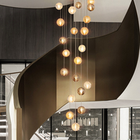 Lustre LED moderne de luxe en fer et verre cristal pour plafonds hauts, hôtels, maisons et escaliers