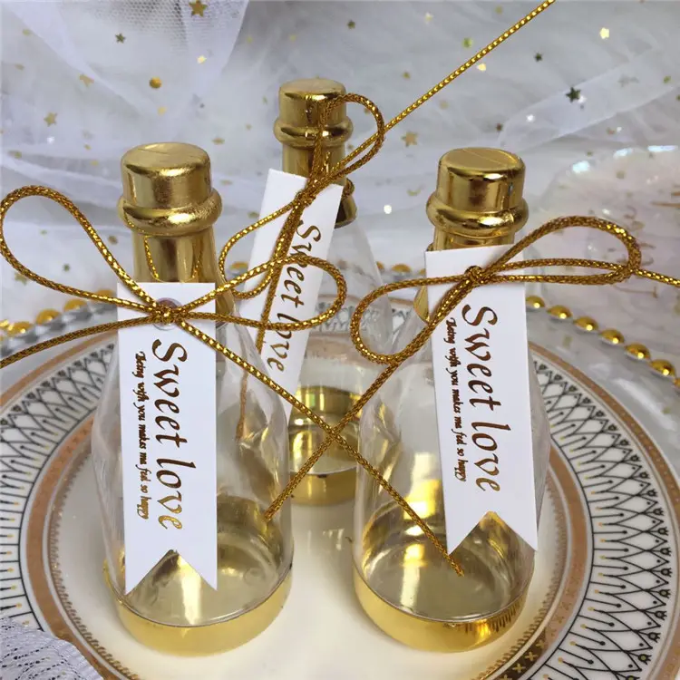 กล่องใส่ลูกกวาดขวดแชมเปญสีทองพร้อมริบบิ้นกล่องของขวัญของที่ระลึกงานแต่งงานกล่องใส่ช็อคโกแลตลูกกวาด