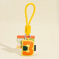 Porte-clés de voiture en cuir PU véritable 5ème génération avec pendentif sac à lettres, best-seller transfrontalier, 26 lettres anglaises, durable