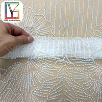 Tissu de dentelle africaine de luxe en tulle brodé de perles blanches et de sequins, lourdement perlé, pour robes de mariée