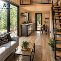 Maison préfabriquée modulaire moderne en acier à deux étages avec balcon et escalier en colimaçon pour un salon élégant