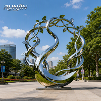 Grande sculpture d'art métallique en acier inoxydable poli miroir, motif abstrait de vigne, feuilles et branches entrelacées, pour place publique, fabrication sur mesure