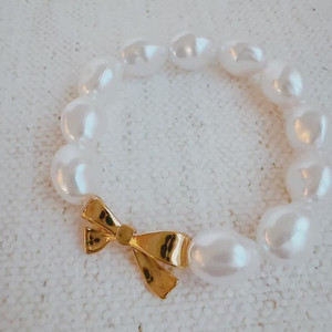 Bracelet extensible en perles avec nœud doré - Product Image 1