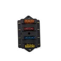 Bloque de Fusibles de Cuchilla para Auto de 12V/24V y 4 Vías con Montaje a Través de Orificio, Construcción de Metal y Plástico, Capacidad de Ruptura de Fusibles de 5A-20A