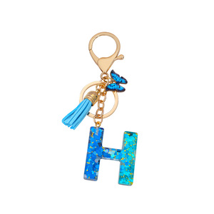 Colgante de borla con letras de la A a la Z en epoxi degradado azul y mariposa, un souvenir muy vendido para <span class=keywords><strong>bolsos</strong></span> de mujer. - Product Image 1