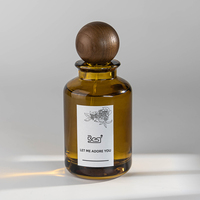 Vente en gros de flacons pulvérisateurs en verre à fond épais de 100ml pour parfum flacon pulvérisateur de parfum rond vide avec couvercle en bois de hêtre