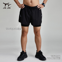 JIEJIN 2027 Nouveaux shorts de sport réfléchissants 2-en-1 noirs unis pour hommes, idéaux pour la course à pied et l'entraînement