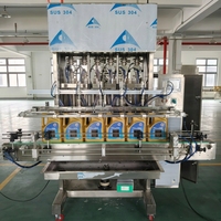 Machine à piston quantitative entièrement automatique de haute précision de 200 ml, contrôlée par PLC, pour l'huile moteur, l'huile lubrifiante et le miel en bouteilles en verre