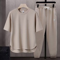Ensemble décontracté ample de mode printemps-été 2025, ensembles de costumes de couleur unie, t-shirt pour homme à manches courtes, pantalon long, pantalon, ensemble deux pièces