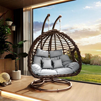 Fauteuil suspendu double moderne de luxe en rotin PE pour extérieur, avec support double en acier robuste et coussins épais, idéal pour salon.
