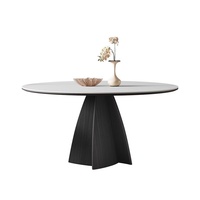 Table à manger en pierre minimaliste moderne italienne en quartzite noir vintage avec plateau central rotatif pour restaurant