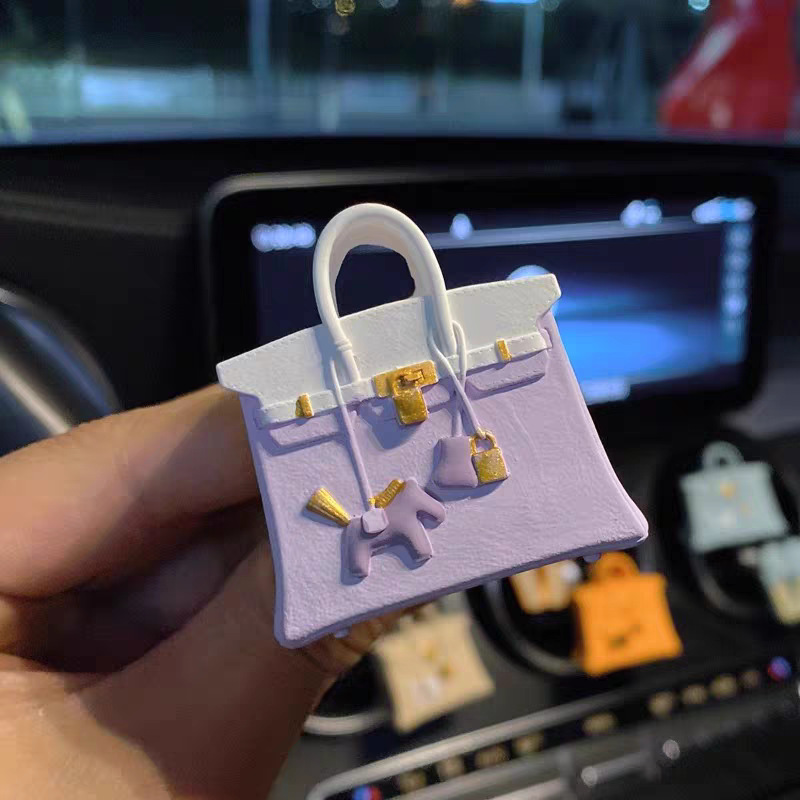 White and purple pony bag