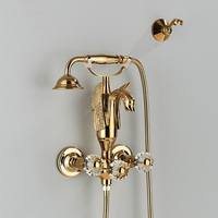 Robinet de baignoire mural STOCCO contemporain doré style cygne français, mitigeur en laiton à double poignée avec douchette à effet pluie, valve en céramique