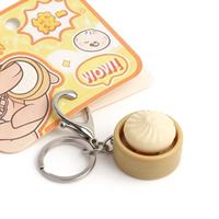 Nouveauté : Porte-clés anti-stress en forme de panier de petits pains vapeur, mignon et écologique, mini pendentif de décompression à presser pour sac à dos