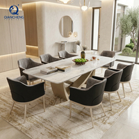 Ensemble de table à manger de luxe en marbre pour 6 personnes avec chaises, base géométrique en acier inoxydable brossé, OEM