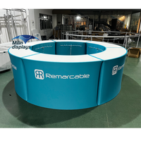 Comptoir de réception circulaire en tissu tendu avec logo imprimé sur table portable de forme ronde pour stand d'exposition