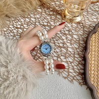 Montre à bracelet élastique avec pointeur de mode, montre à quartz en acier inoxydable avec verre, bracelet de montre en perles pour femmes