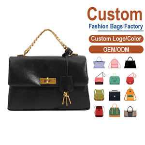 Bolso Bandolera Vintage con Cierre Giratorio - Elegante Bolso de Mano de Cuero Negro con Borla Decorativa y Correa de Cadena - Product Image 1