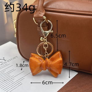 Breloque de sac et porte-clés en PVC, mignonne, légère, en forme de pain, de bretzel ou de croissant, avec nœud, accessoire de bijouterie pour sac à dos - Product Image 4