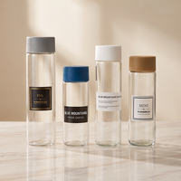 Bouteilles de thé en verre transparent minces en gros avec bouchons à vis personnalisés pour l'emballage de thé aux fleurs, d'eau citronnée et de boissons