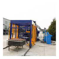 Machine automatique de fabrication de blocs et de briques en béton à pression hydraulique Qt4-15 avec moteur et boîte de vitesses