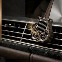 Diffuseur d'arômes et désodorisant de voiture en alliage de zinc en forme d'harpe, nouveau style transfrontalier, à fixer sur la grille d'aération