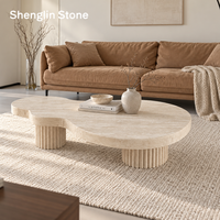 Table basse en travertin naturel au design créatif ODM, base en piédestal cannelé irrégulière, table à cocktail pour la décoration moderne du salon